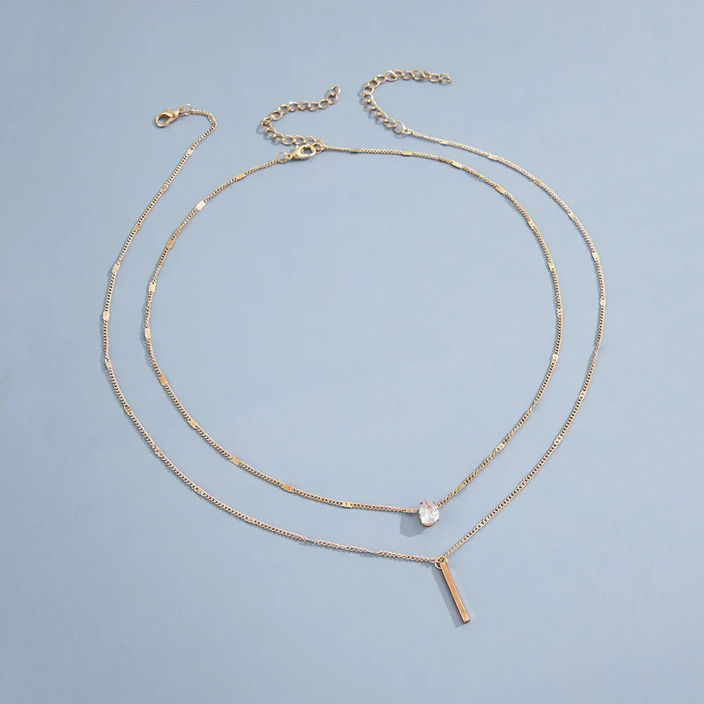 Collier Double Chaîne à Double Pendentif Doré