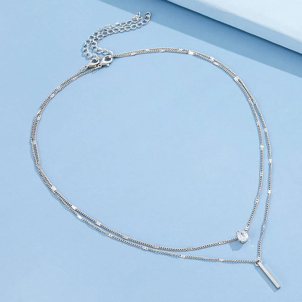 Collier Double Chaîne à Double Pendentif Argenté